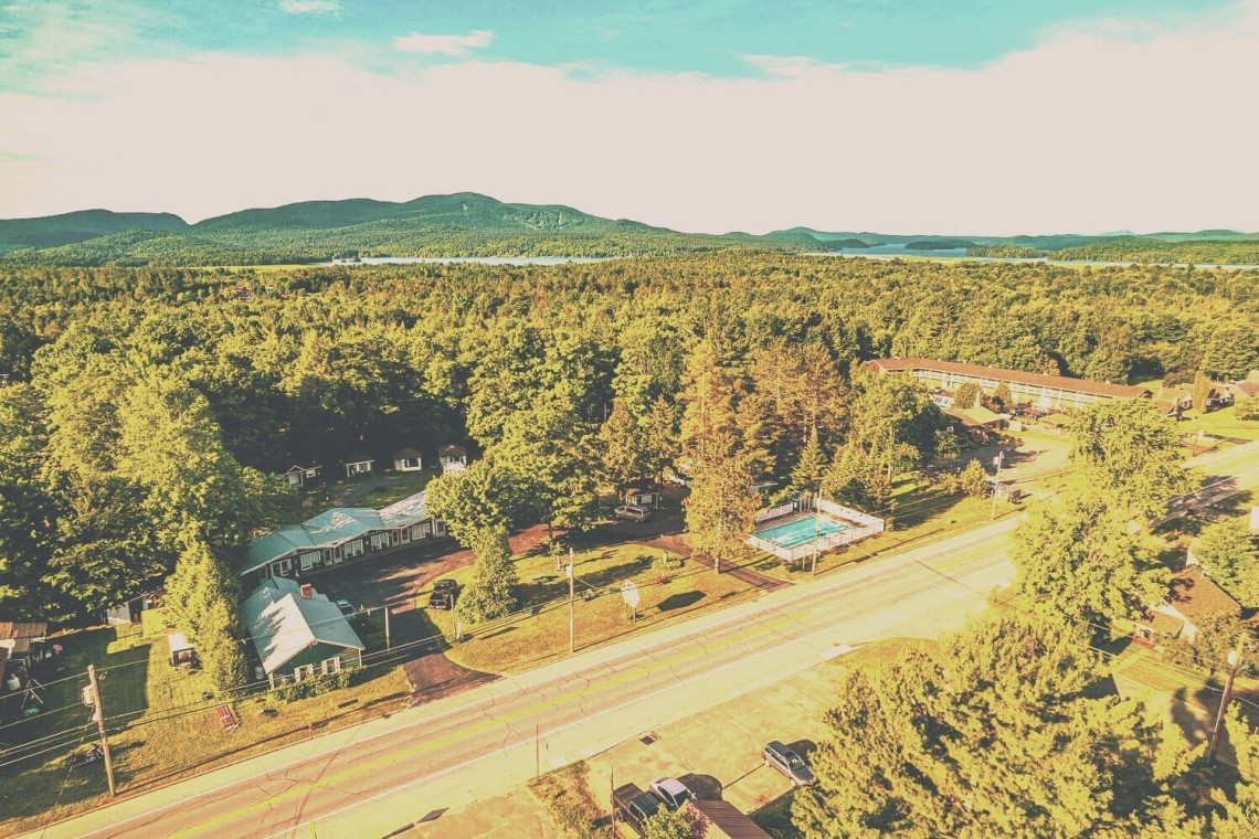 Aerial view of The Dax Motel & Cabins nestled in the Adirondack forest